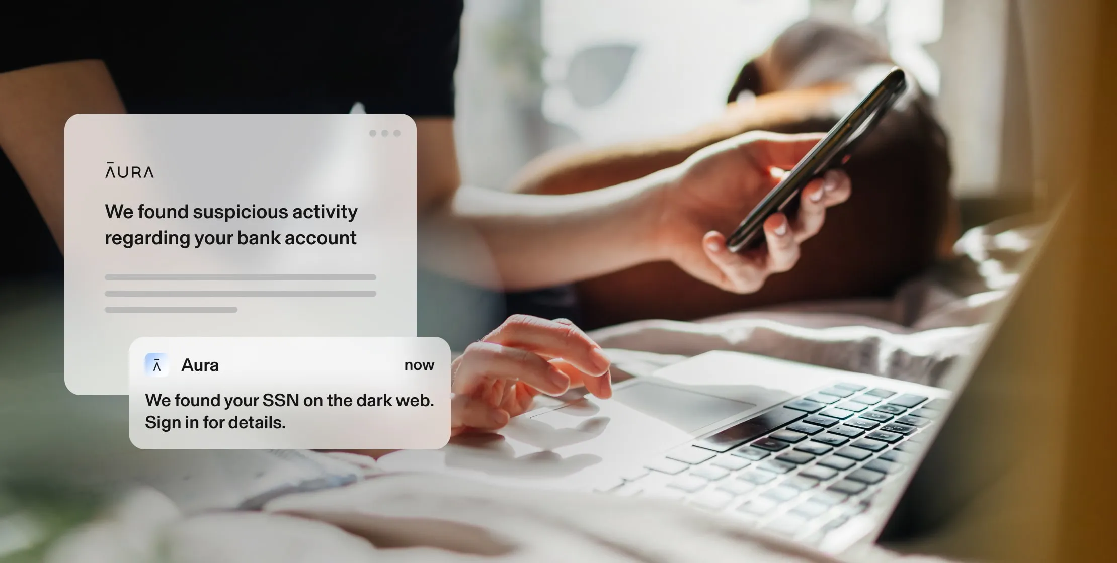 A pair of hands, — one at a laptop, the other using a phone — next to Aura alerts. Alerts: We found suspicious activity regarding your bank. We found your SSN on the dark web. Sign in for details. 